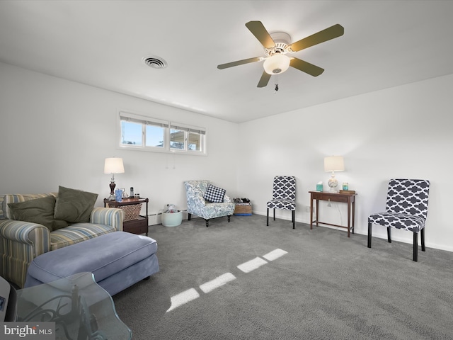 living area featuring carpet, visible vents, ceiling fan, and baseboards