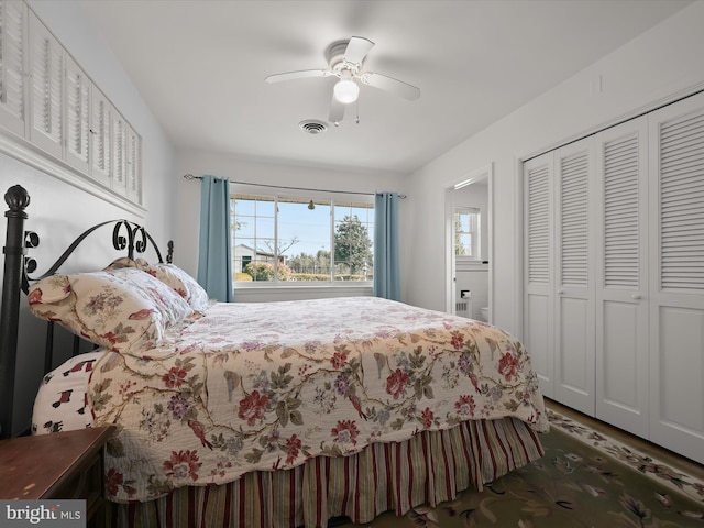 bedroom featuring ceiling fan, visible vents, and a closet