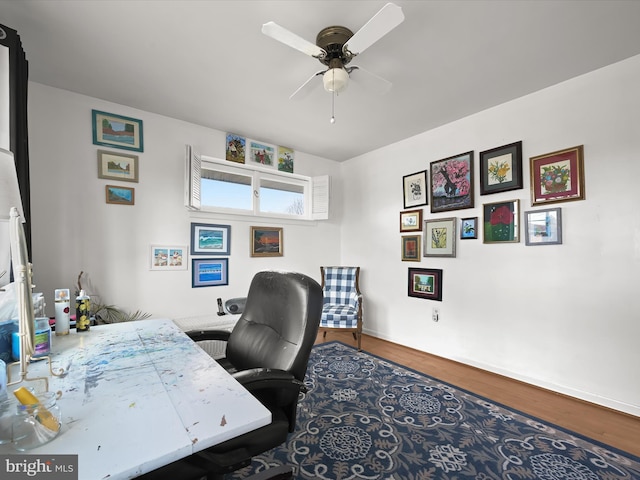 office space featuring ceiling fan and wood finished floors