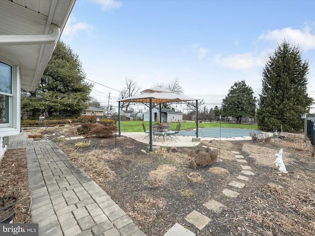 view of yard featuring fence and a patio