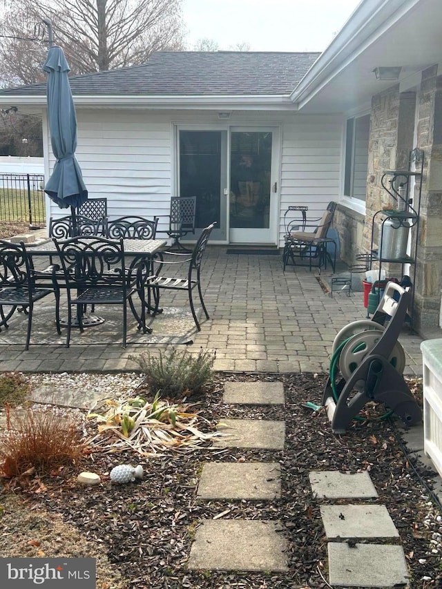 view of patio / terrace featuring fence