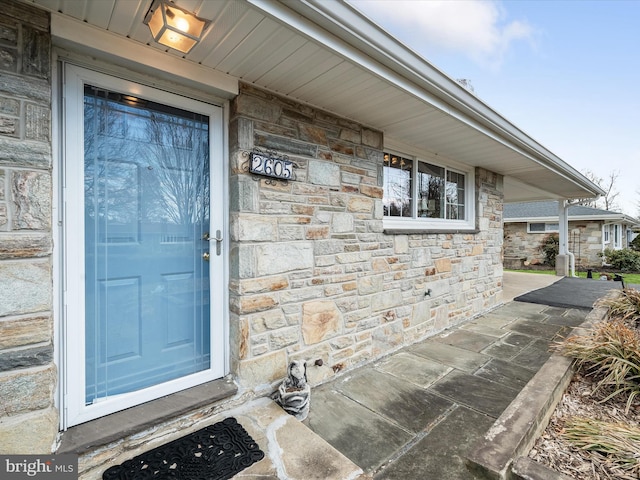 view of exterior entry with stone siding