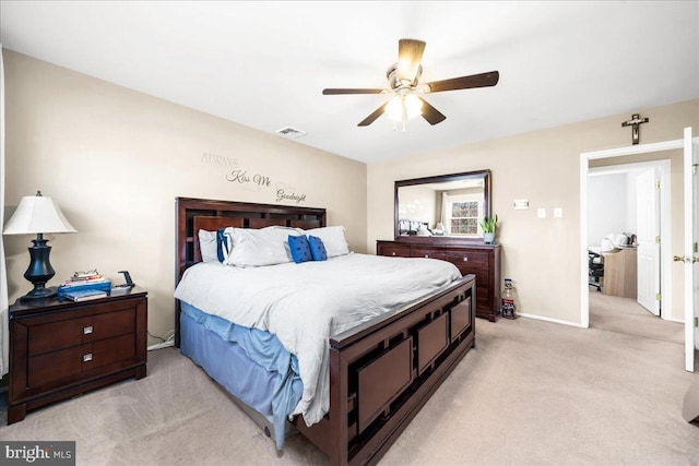 bedroom featuring ceiling fan and light carpet