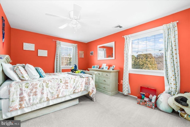 carpeted bedroom featuring ceiling fan