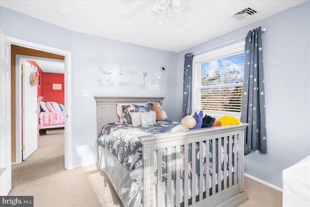 carpeted bedroom featuring ceiling fan