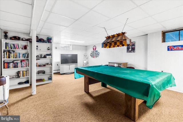 playroom with built in shelves, carpet floors, a baseboard radiator, and a paneled ceiling