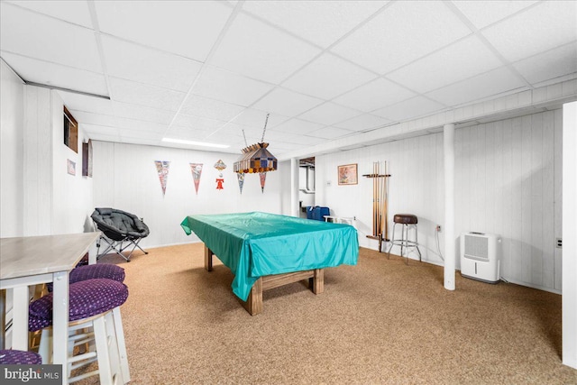 rec room with carpet, a paneled ceiling, wooden walls, and billiards