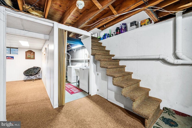 basement with carpet and independent washer and dryer