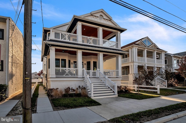 view of front of home featuring a porch and a balcony