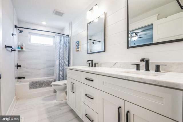 full bathroom featuring vanity, toilet, and shower / tub combo