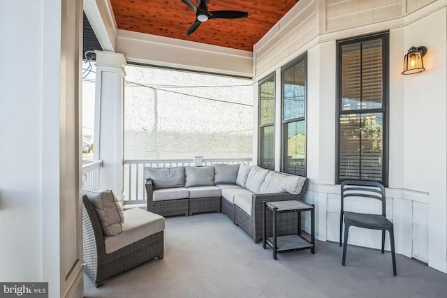 sunroom / solarium featuring ceiling fan and wood ceiling