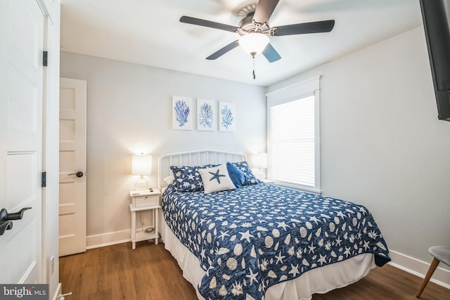 bedroom featuring dark hardwood / wood-style flooring and ceiling fan