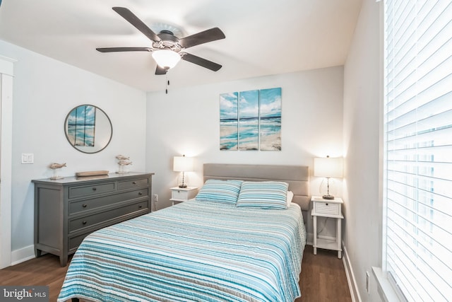 bedroom featuring ceiling fan and dark hardwood / wood-style flooring