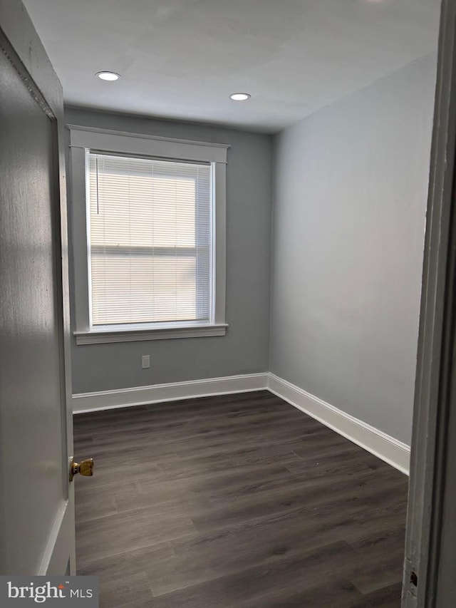 unfurnished room featuring dark hardwood / wood-style floors