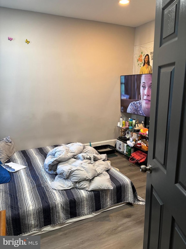 bedroom featuring hardwood / wood-style floors