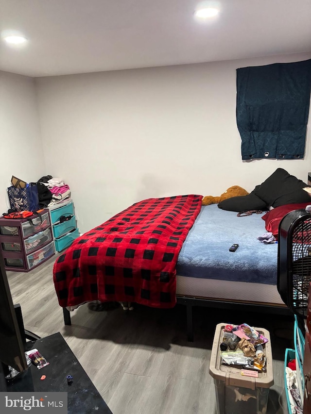 bedroom with hardwood / wood-style floors