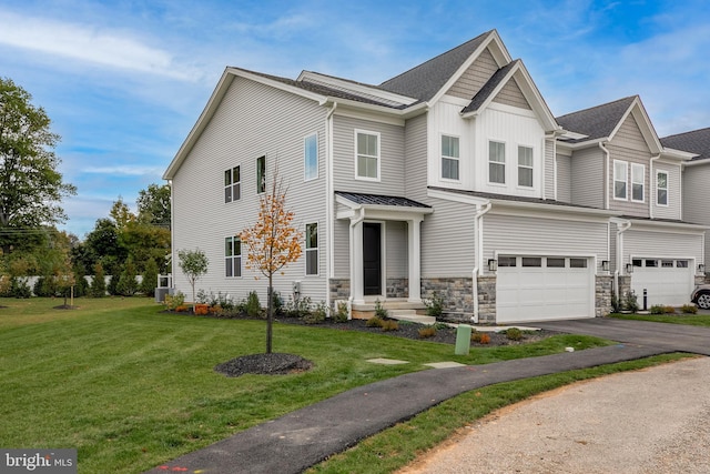 view of front of property featuring a garage and a front lawn