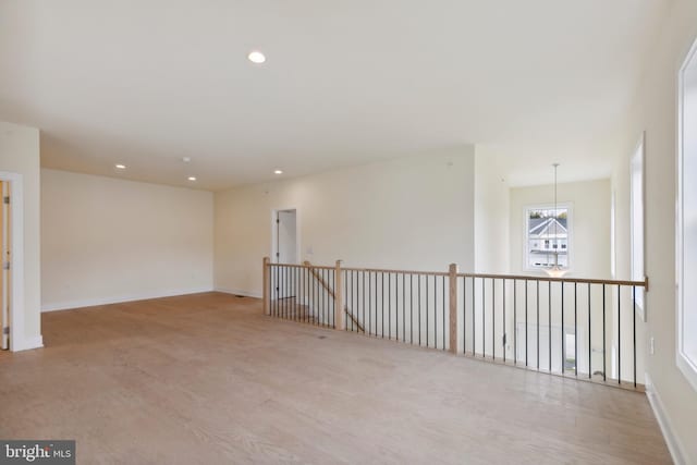 spare room featuring light wood-type flooring