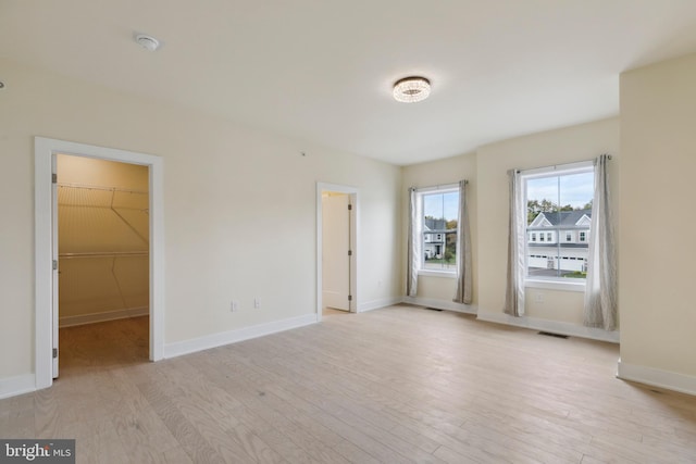 unfurnished room featuring light hardwood / wood-style flooring