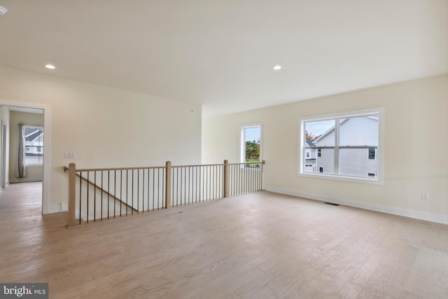 unfurnished room featuring light wood-type flooring