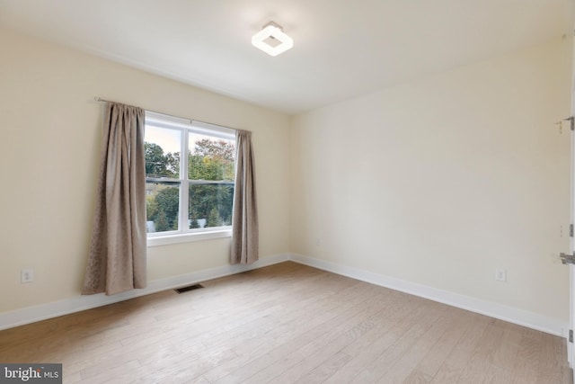 unfurnished room featuring light hardwood / wood-style floors