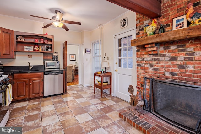 kitchen with dishwasher, white range, sink, crown molding, and ceiling fan