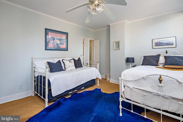 bedroom featuring carpet flooring, ceiling fan, and crown molding