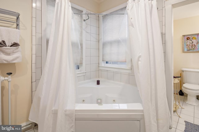 bathroom with tile patterned flooring and toilet