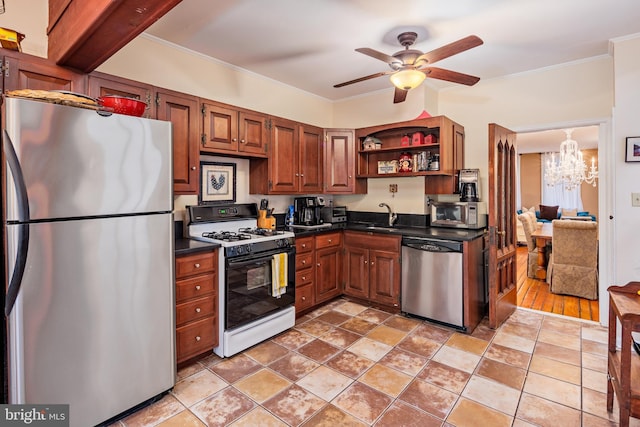 kitchen featuring sink, ceiling fan with notable chandelier, crown molding, and stainless steel appliances