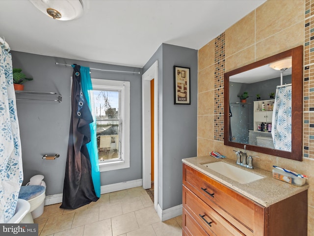 bathroom with tile patterned floors, vanity, toilet, and backsplash