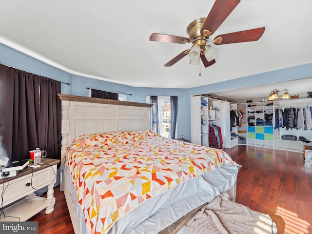 bedroom with ceiling fan and dark hardwood / wood-style floors