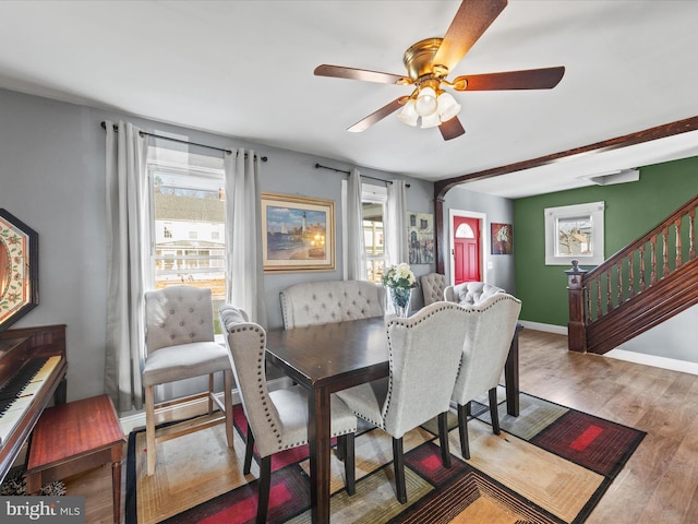 dining room with wood-type flooring and ceiling fan