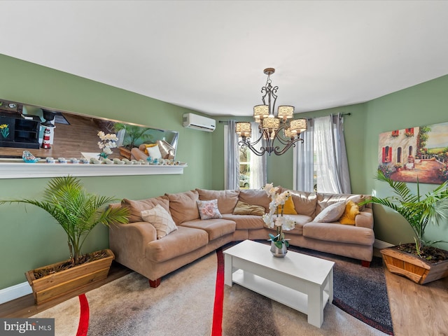 living room with hardwood / wood-style flooring, a chandelier, and an AC wall unit