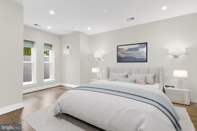 bedroom with hardwood / wood-style floors