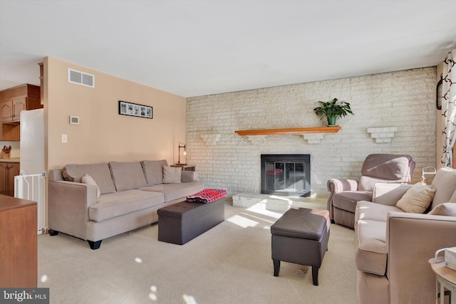 carpeted living room with a fireplace