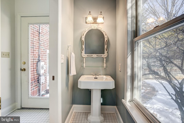 bathroom with tile patterned flooring and plenty of natural light