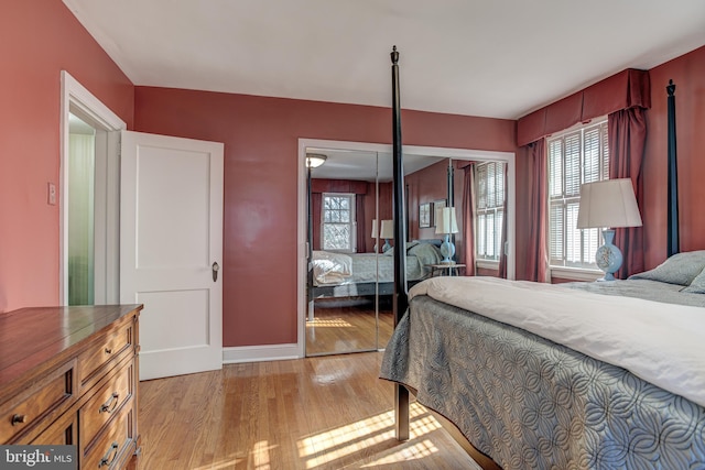 bedroom featuring light hardwood / wood-style flooring and a closet