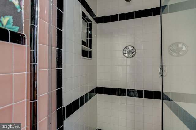 bathroom with tiled shower