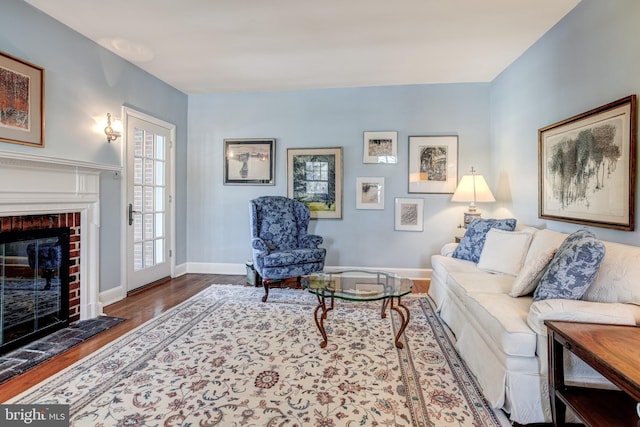 living room with a fireplace and hardwood / wood-style floors