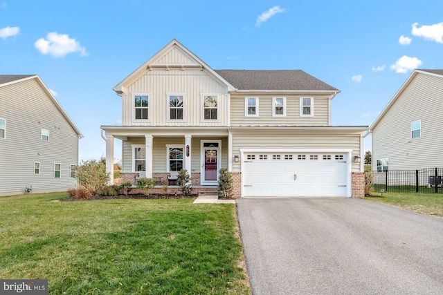 view of front of house featuring a front yard and a garage