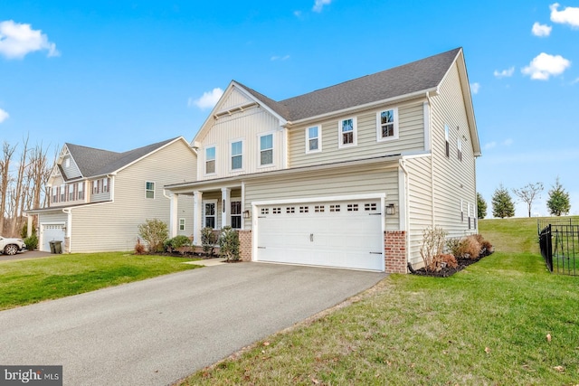 view of front of house featuring a garage and a front yard