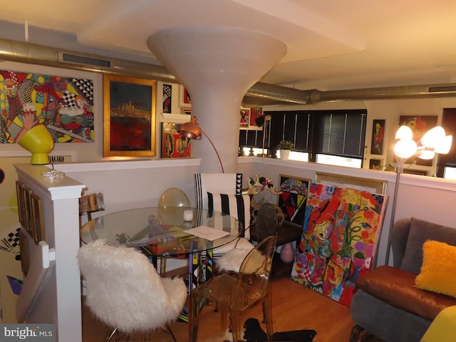 dining area with wood-type flooring