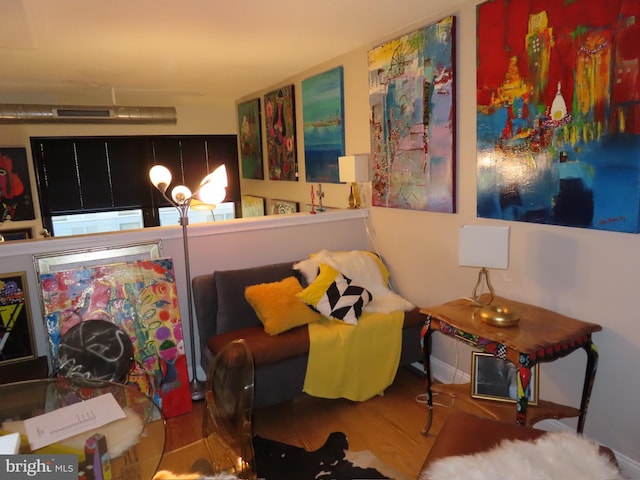 sitting room featuring wood-type flooring