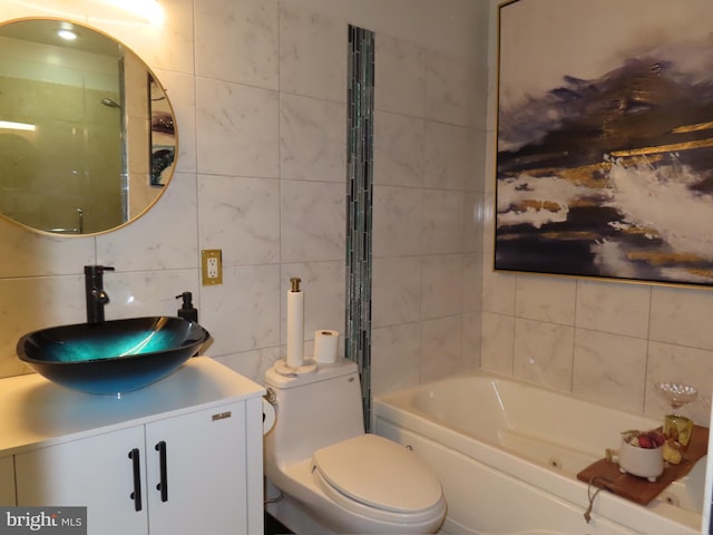 full bathroom featuring vanity, toilet, shower / bath combination, and tile walls