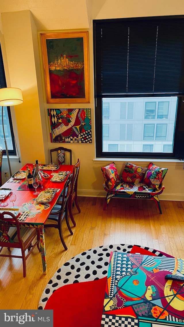 dining space featuring hardwood / wood-style flooring