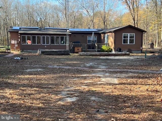 view of front of house with a sunroom