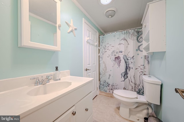 bathroom with crown molding, vanity, a shower with shower curtain, and toilet