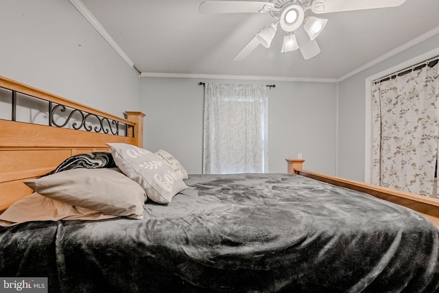 bedroom with ceiling fan and ornamental molding