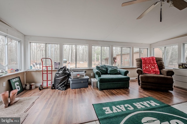 sunroom featuring a wealth of natural light, ceiling fan, and vaulted ceiling