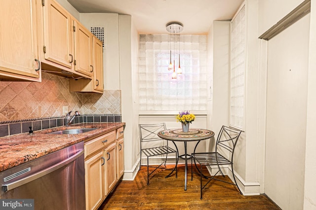 kitchen featuring pendant lighting, dishwasher, light brown cabinets, dark wood-type flooring, and sink